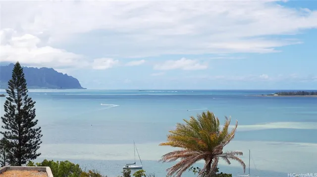 a bedroom with a bed a mirror and chair