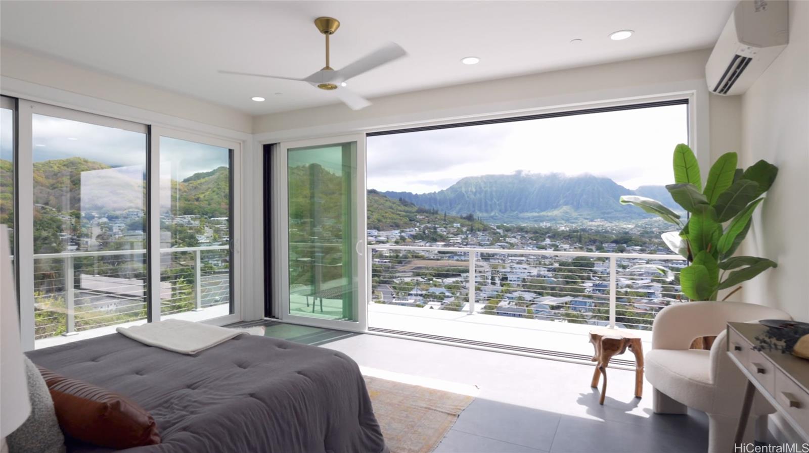 44-652 Kaneohe Bay Drive, Unit A Kaneohe, HI 96744 - Photo 16 of 25 a bedroom with a large window and a bed