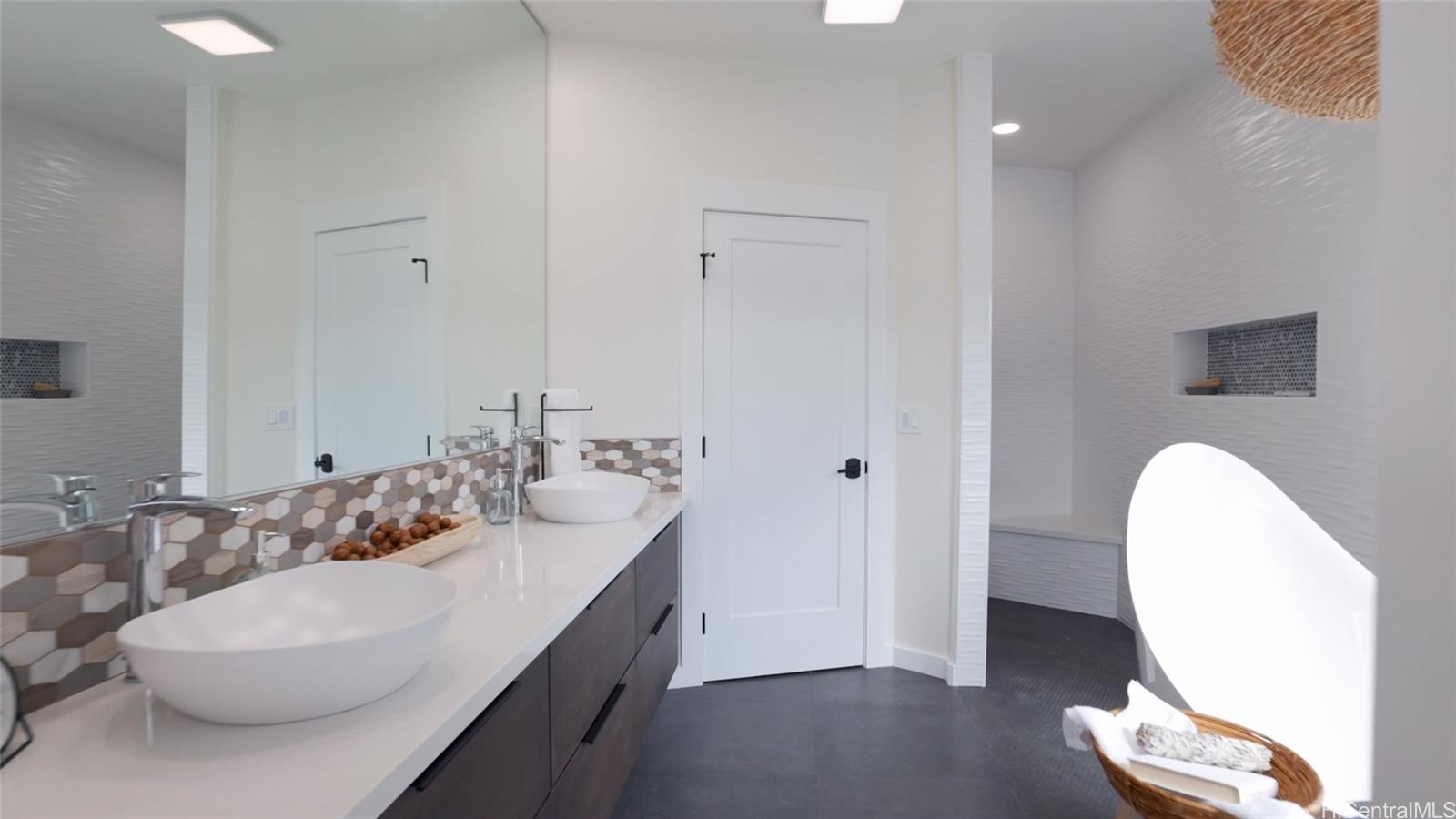 44-652 Kaneohe Bay Drive, Unit A Kaneohe, HI 96744 - Photo 18 of 25 a bathroom with a sink and a mirror