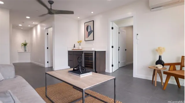 a bedroom with a large bed and a large window