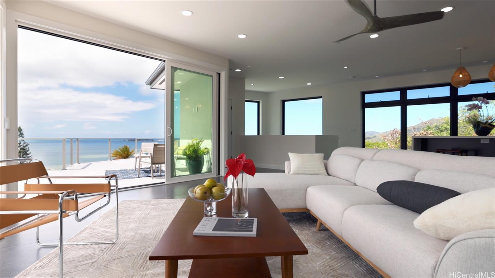 44-652 Kaneohe Bay Drive, Unit A Kaneohe, HI 96744 - Photo 2 of 25 a living room with furniture and a large window