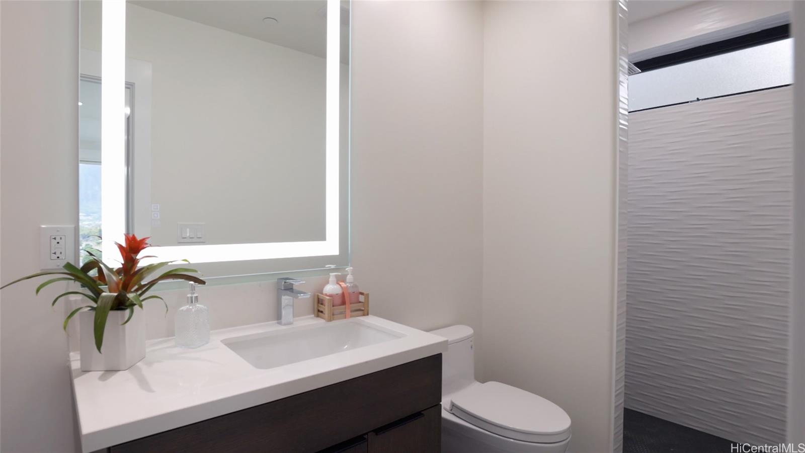 44-652 Kaneohe Bay Drive, Unit A Kaneohe, HI 96744 - Photo 23 of 25 a bathroom with a sink toilet and mirror