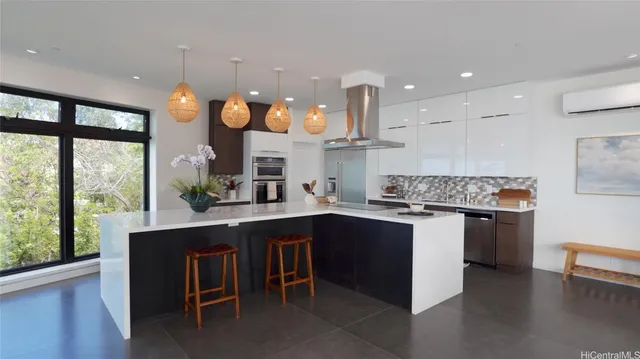 a kitchen with a sink cabinets and wooden floor