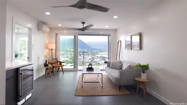 a living room with furniture and a large window