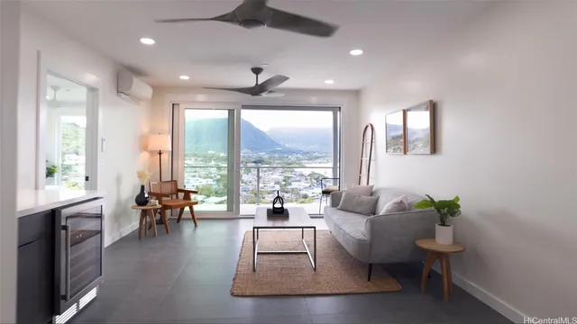 a living room with furniture and a large window