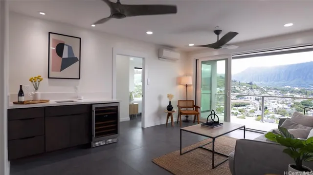 a living room with furniture a rug and a large window