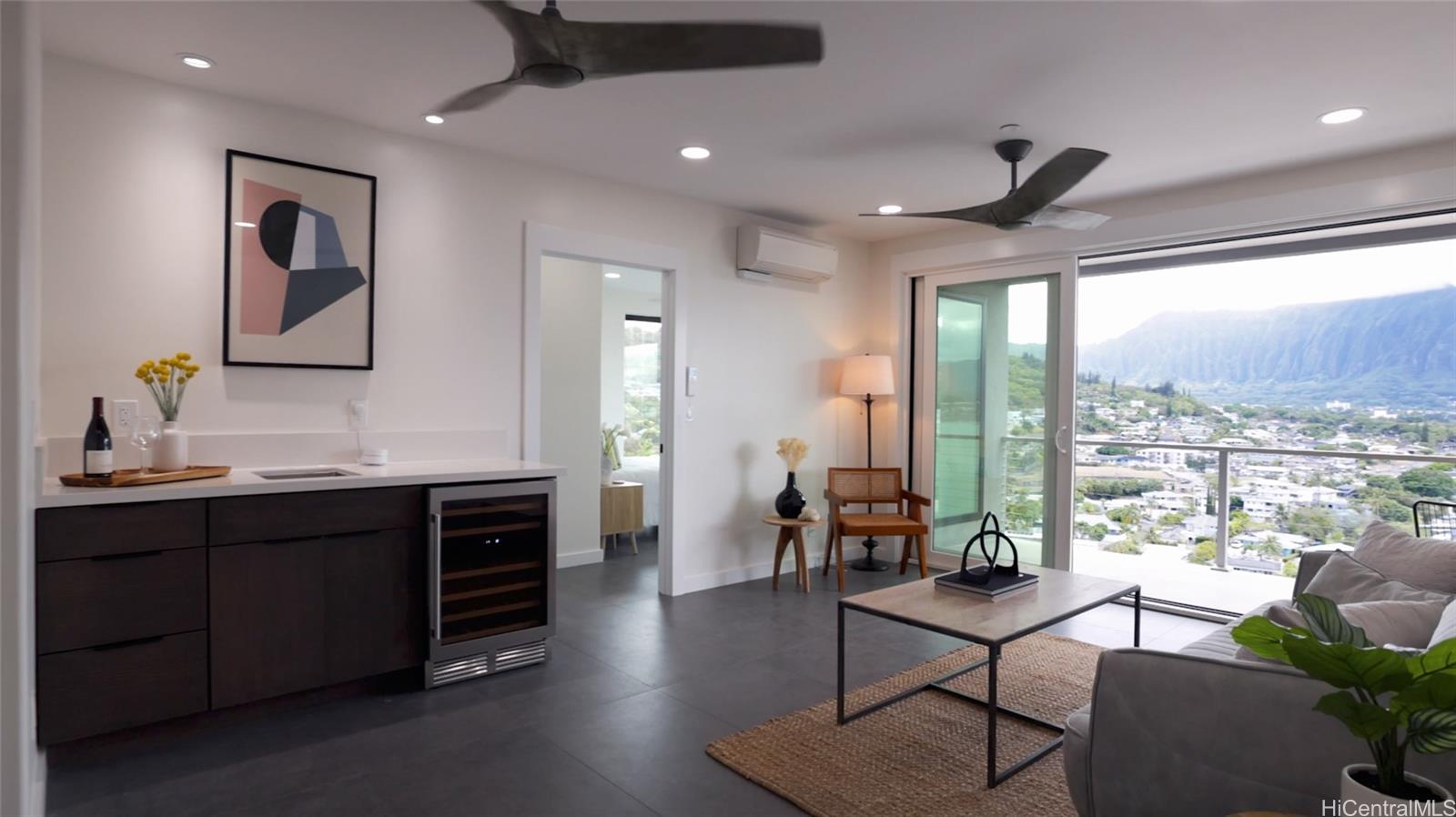 44-652 Kaneohe Bay Drive, Unit A Kaneohe, HI 96744 - Photo 7 of 25 a living room with furniture a rug and a large window
