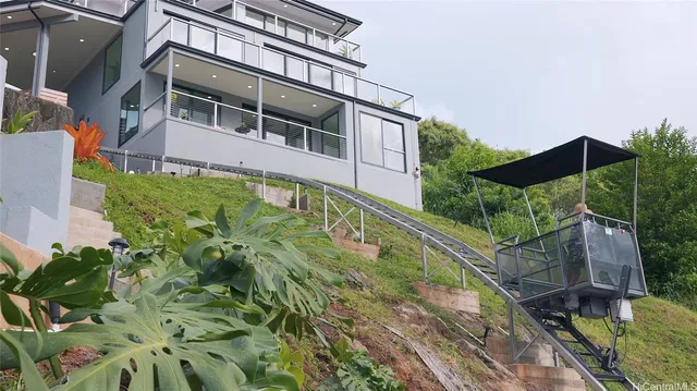 a aerial view of a house with a yard