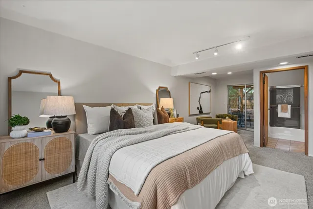 a bedroom with bed and window