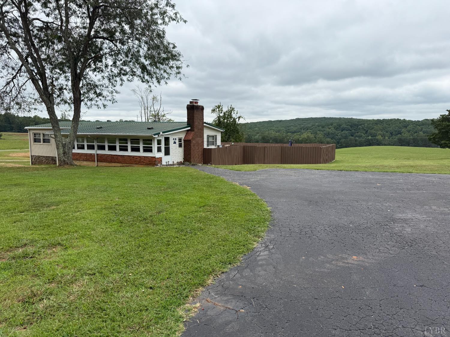 1046 Clarks Road Rustburg, VA 24588 - Photo 1 of 19 a view of a house with a yard