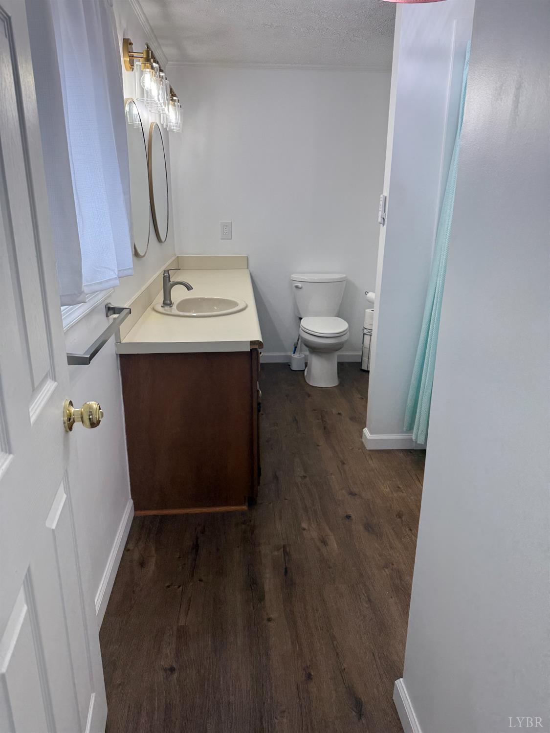 1046 Clarks Road Rustburg, VA 24588 - Photo 9 of 19 a bathroom with a sink toilet and shower