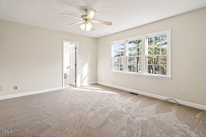 6733 Oviedo Drive Raleigh, NC 27603 - Photo 16 of 33 a view of an empty room with a window