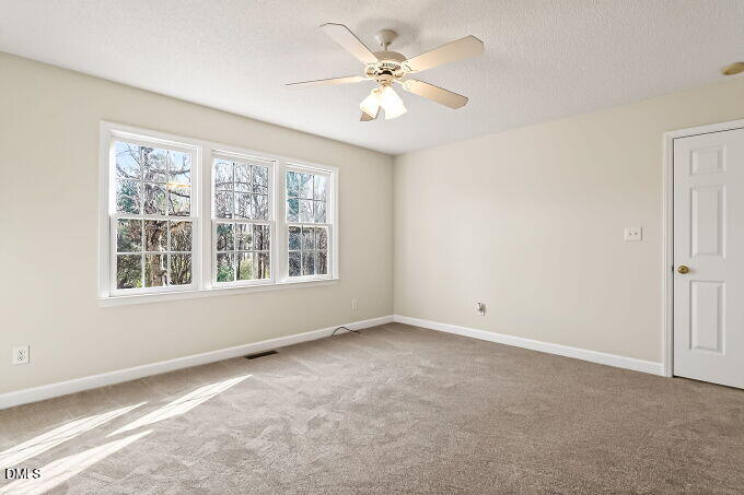 6733 Oviedo Drive Raleigh, NC 27603 - Photo 17 of 33 a view of an empty room with a window