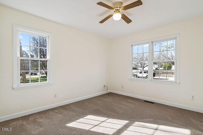 6733 Oviedo Drive Raleigh, NC 27603 - Photo 21 of 33 an empty room with windows