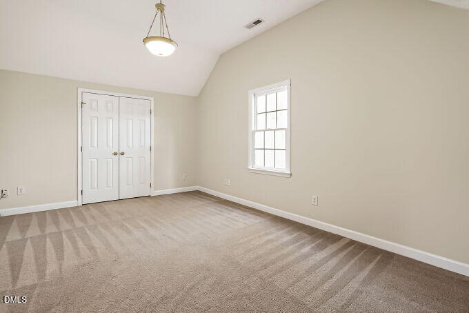 6733 Oviedo Drive Raleigh, NC 27603 - Photo 24 of 33 an empty room with windows