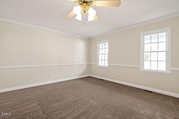 6733 Oviedo Drive Raleigh, NC 27603 - Photo 5 of 33 an empty room with a window