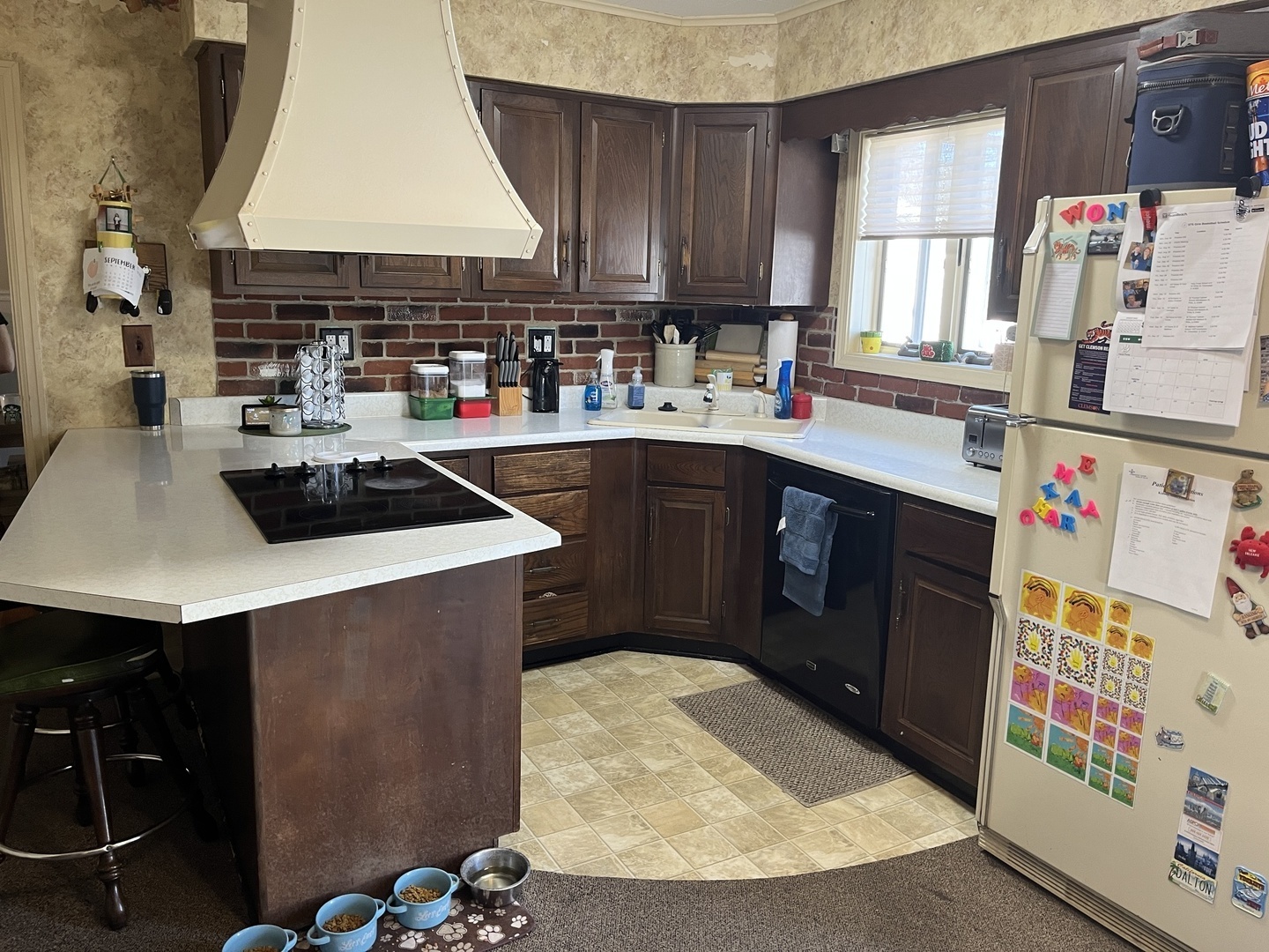 310 North Main Street Rankin, IL 60960 - Photo 4 of 17 a kitchen with kitchen island granite countertop a sink a stove and a microwave