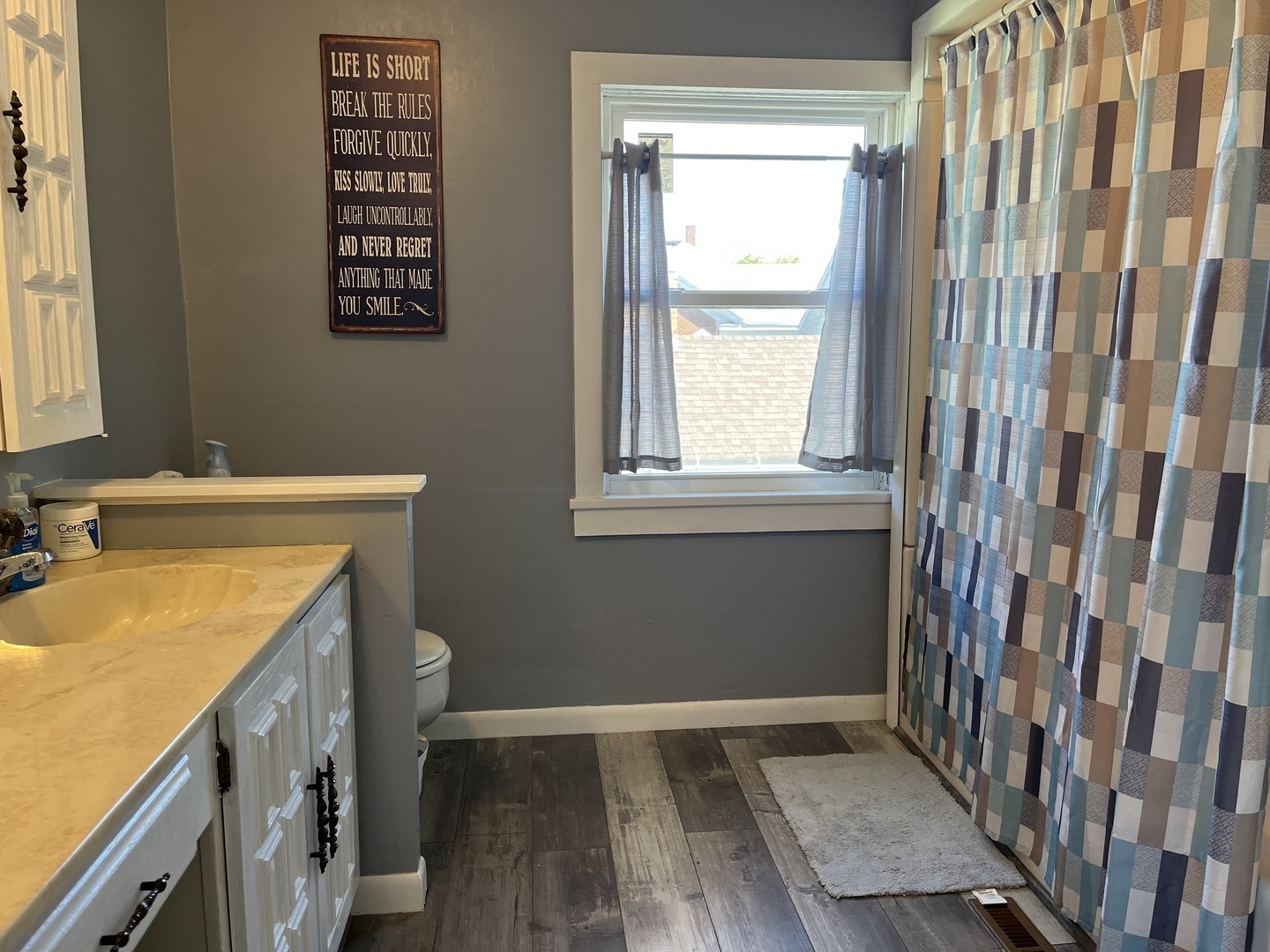 310 North Main Street Rankin, IL 60960 - Photo 10 of 17 a view of a bathroom with a sink and a window