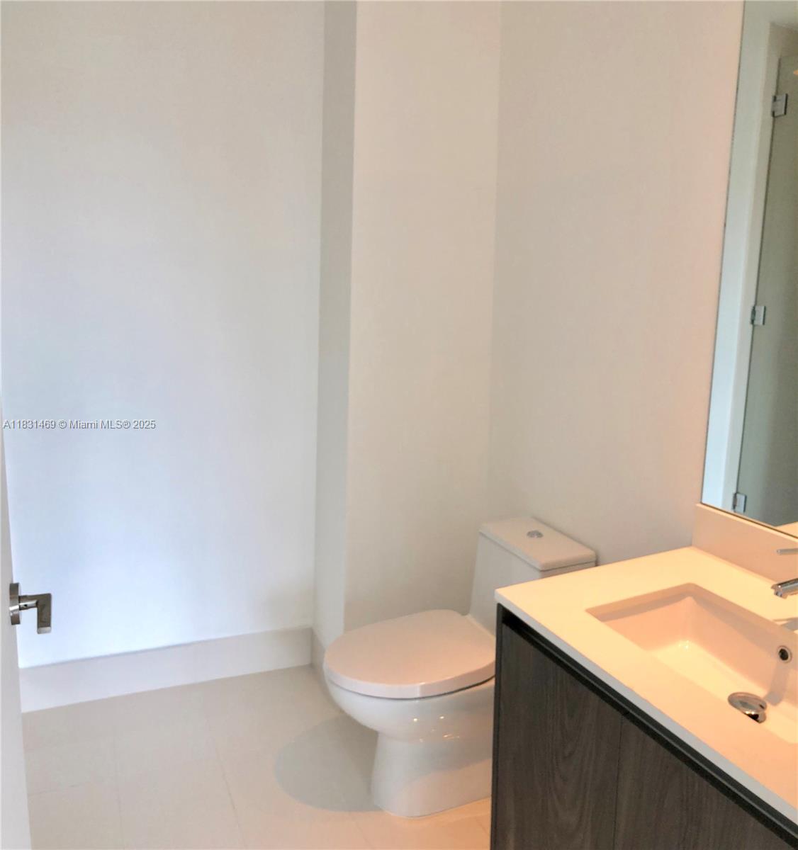 480 Northeast 31st Street, Unit 705 Miami, FL 33137 - Photo 11 of 32 a bathroom with a sink and toilet