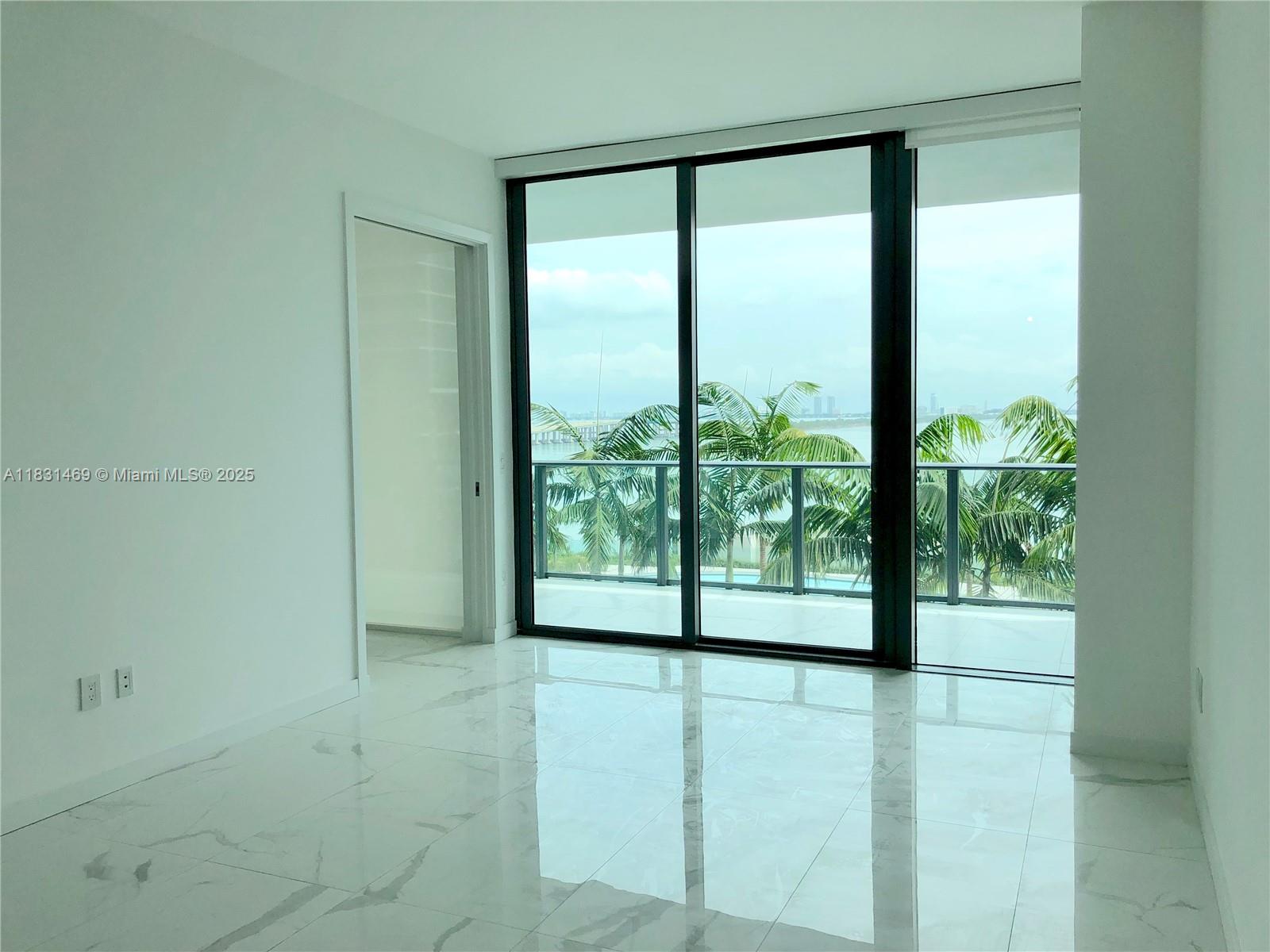 480 Northeast 31st Street, Unit 705 Miami, FL 33137 - Photo 6 of 32 a view of an empty room and window