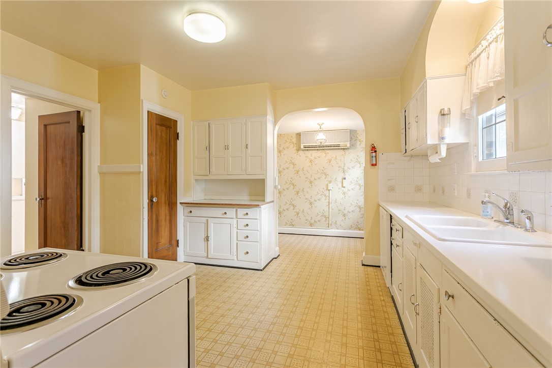 581 Claybourne Road Brighton, NY 14618 - Photo 12 of 40 Kitchen with Corian counters and breakfast nook