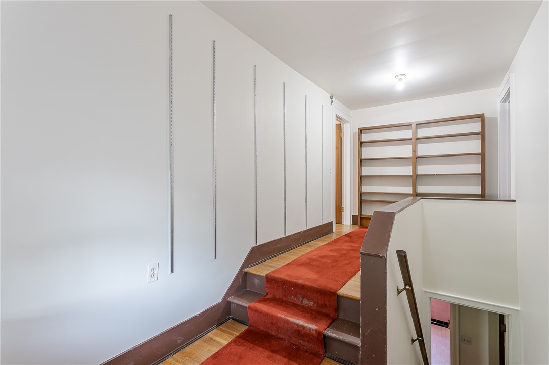 581 Claybourne Road Brighton, NY 14618 - Photo 29 of 40 3rd floor hallway with bookshelves