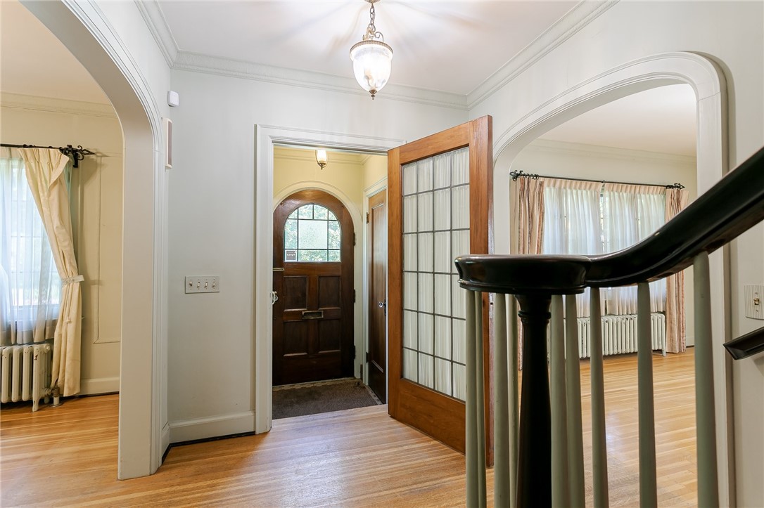 581 Claybourne Road Brighton, NY 14618 - Photo 9 of 40 Main Foyer with beautiful double wooden door entra