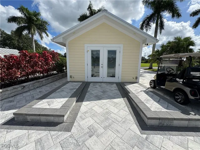 a bathroom with a granite countertop sink toilet and a mirror