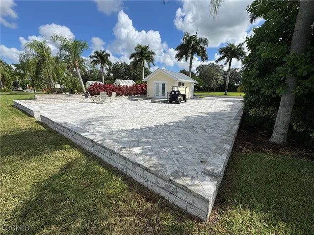 a view of a backyard of the house