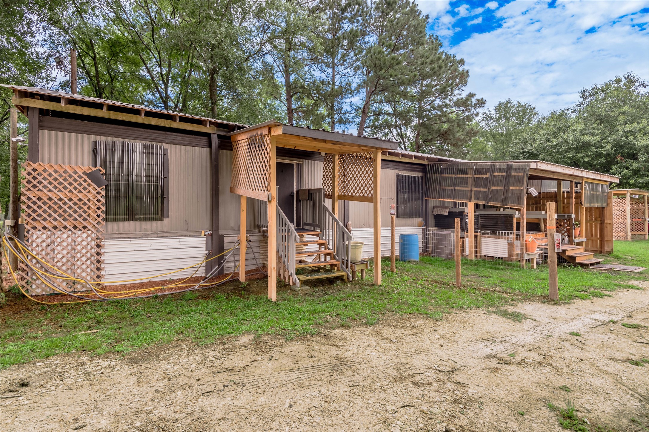 159 Pecan Avenue Groveton, TX 75845 - Photo 3 of 27 a view of a house with a backyard