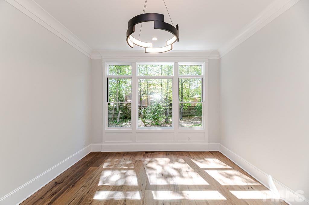 10822 Grand Journey Avenue Raleigh, NC 27614 - Photo 13 of 41 a view of an empty room and window