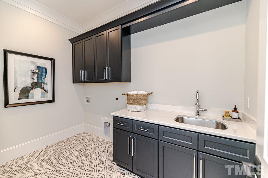 10822 Grand Journey Avenue Raleigh, NC 27614 - Photo 16 of 41 a bathroom with a sink and a mirror