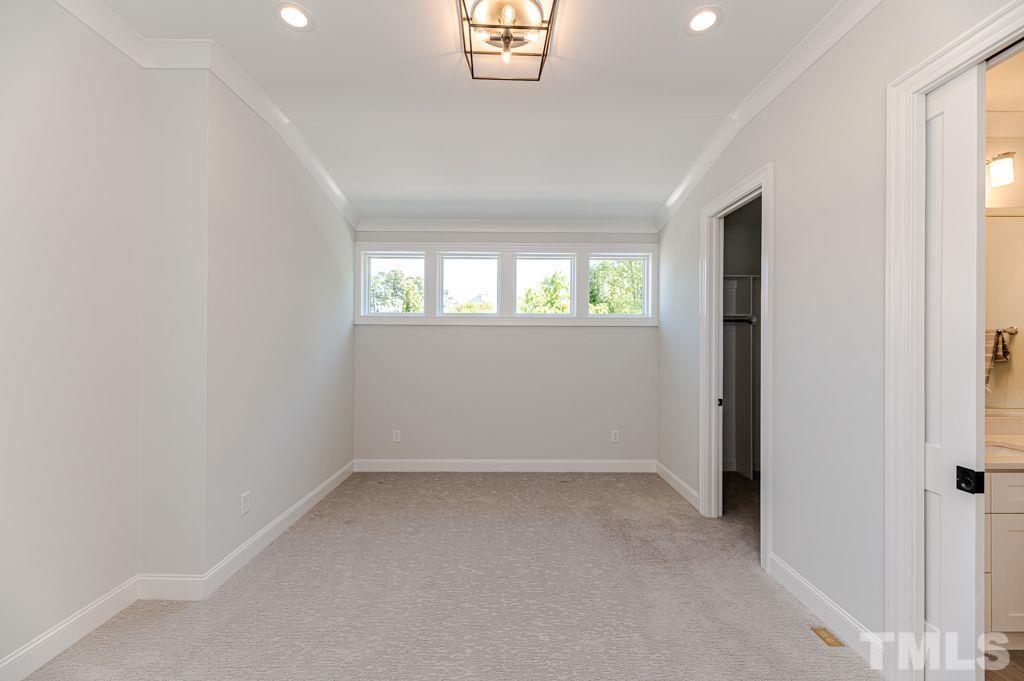 10822 Grand Journey Avenue Raleigh, NC 27614 - Photo 25 of 41 an empty room with windows