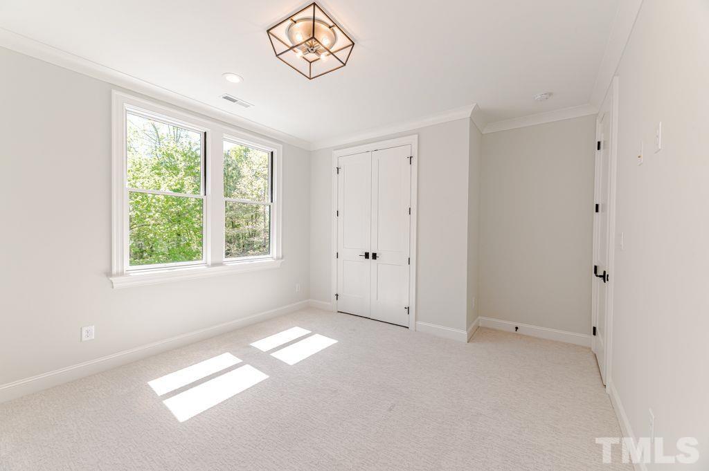 10822 Grand Journey Avenue Raleigh, NC 27614 - Photo 28 of 41 a view of empty room with window