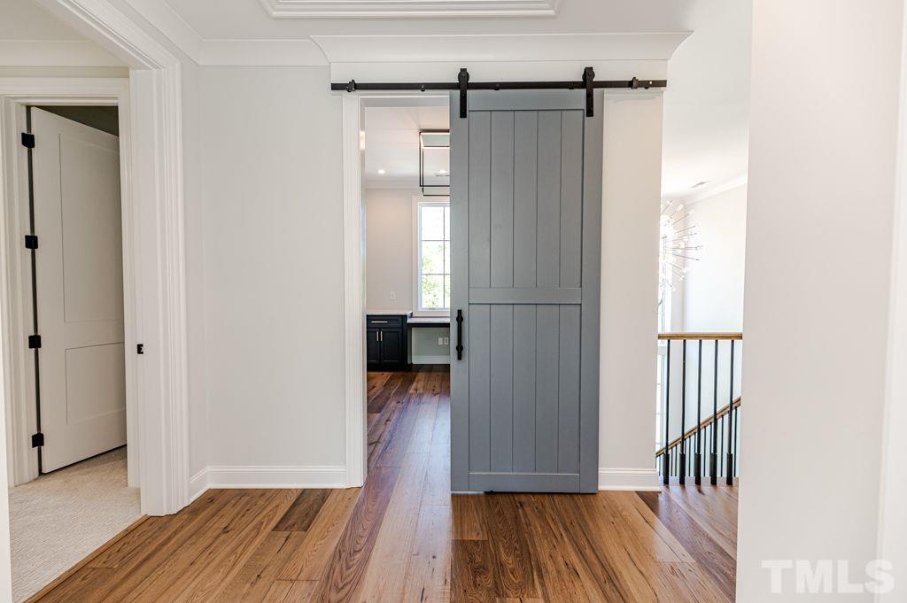 10822 Grand Journey Avenue Raleigh, NC 27614 - Photo 30 of 41 a view of hallway with wooden floor