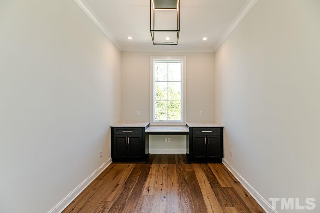 10822 Grand Journey Avenue Raleigh, NC 27614 - Photo 31 of 41 wooden floor in an empty room with a window