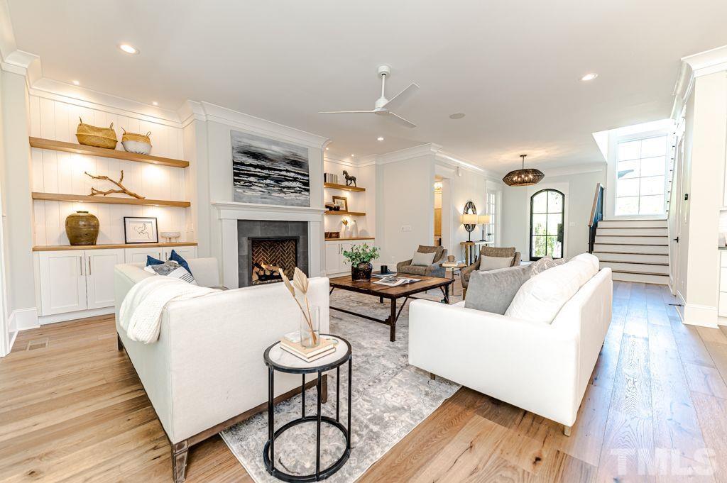 10822 Grand Journey Avenue Raleigh, NC 27614 - Photo 6 of 41 a living room with fireplace furniture and a fireplace