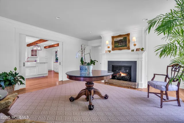 a living room with furniture and kitchen view