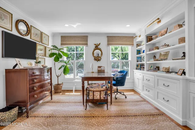 a view of a patio with table and chairs and potted plants