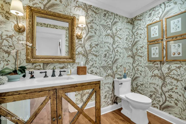 a living room with furniture a fireplace and a large window