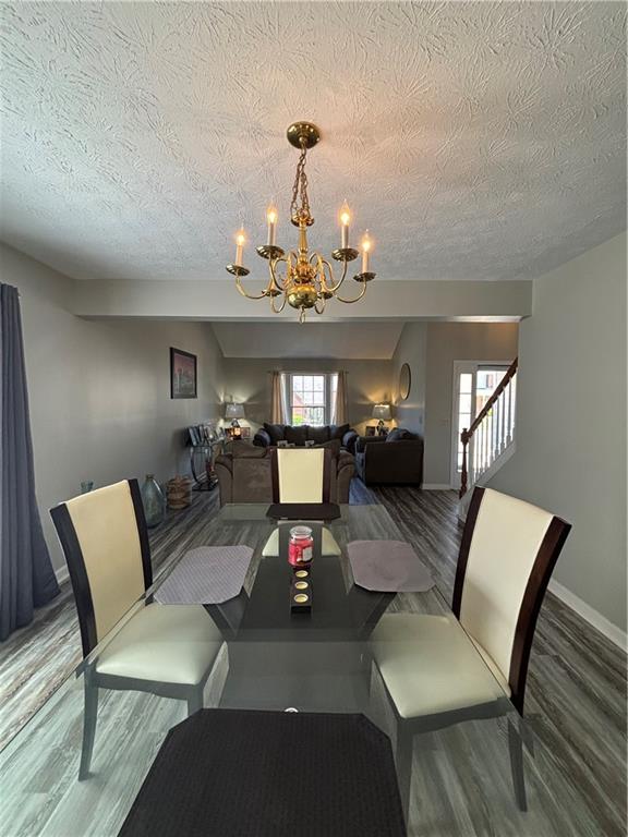 4949 Penscot Way Stone Mountain, GA 30088 - Photo 6 of 40 a living room with furniture and a chandelier