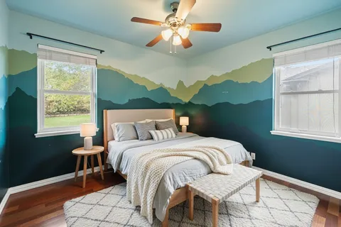 a bedroom with a bed and a window