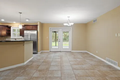 a view of a kitchen with a sink and a window