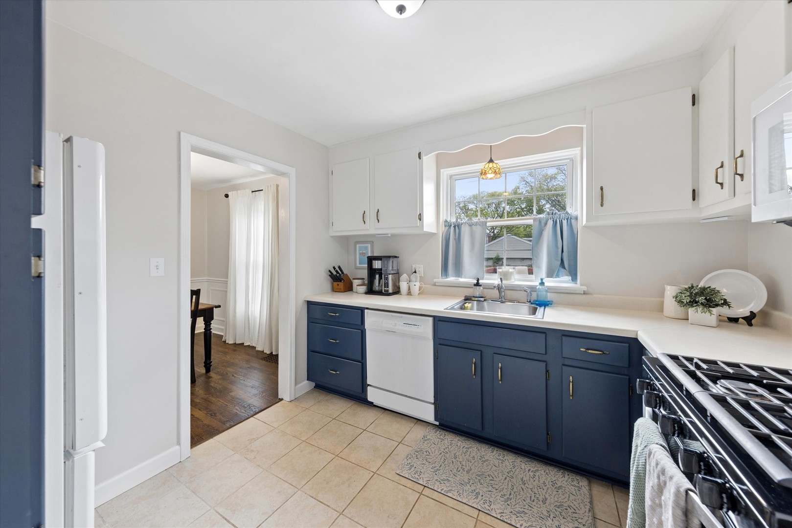 842 Forest Road La Grange Park, IL 60526 - Photo 8 of 21 a kitchen with a sink window and cabinets