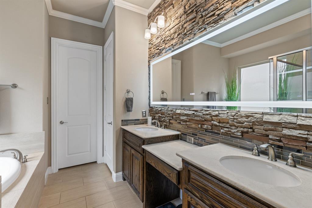 4711 Taylor Lane Grapevine, TX 76051 - Photo 16 of 31 a bathroom with a sink and a mirror
