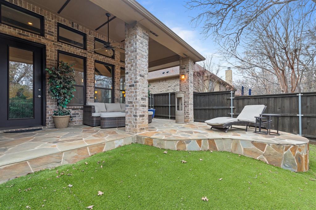 4711 Taylor Lane Grapevine, TX 76051 - Photo 28 of 31 a view of a patio with a chairs and table in the patio