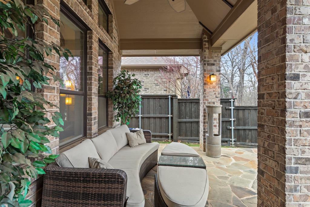 4711 Taylor Lane Grapevine, TX 76051 - Photo 29 of 31 a backyard of a house with table and chairs