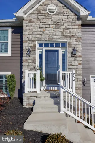 a front view of a house with a porch