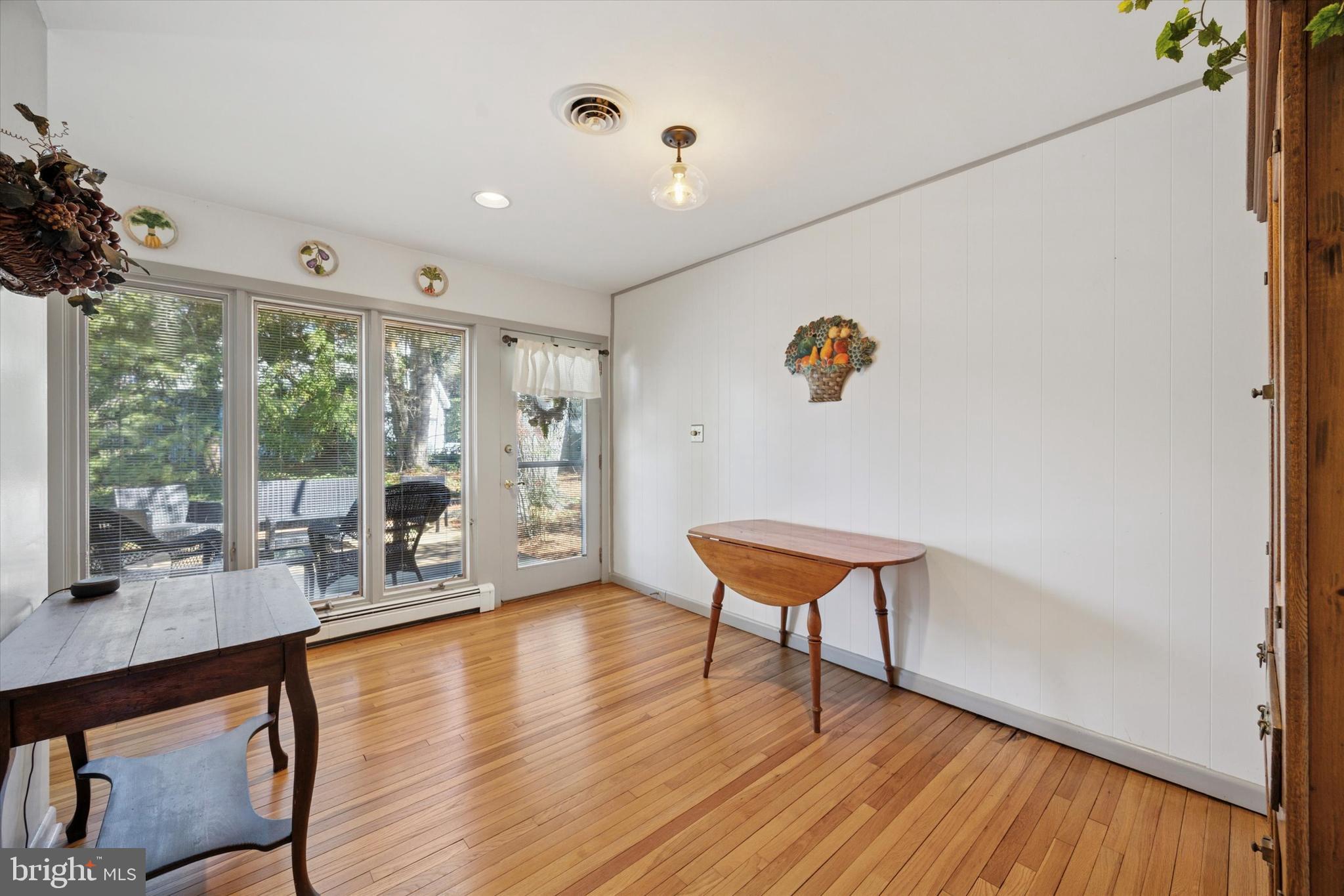 1111 Hagues Mill Road Ambler, PA 19002 - Photo 12 of 31 a living room with furniture a rug potted plant and a large window