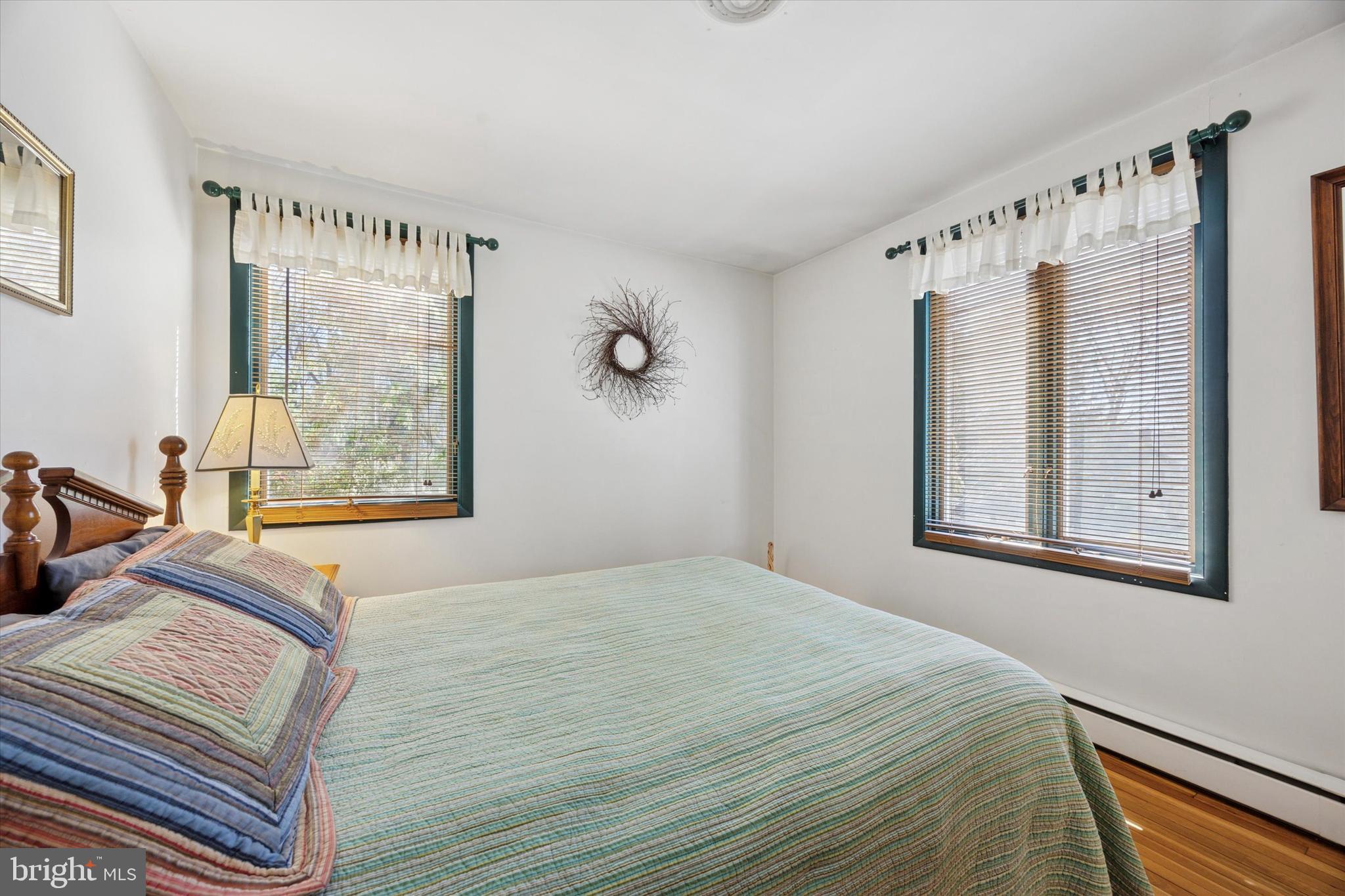 1111 Hagues Mill Road Ambler, PA 19002 - Photo 18 of 31 a bedroom with bed window and mirror